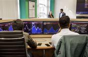 Two students working in the Trading Floor
